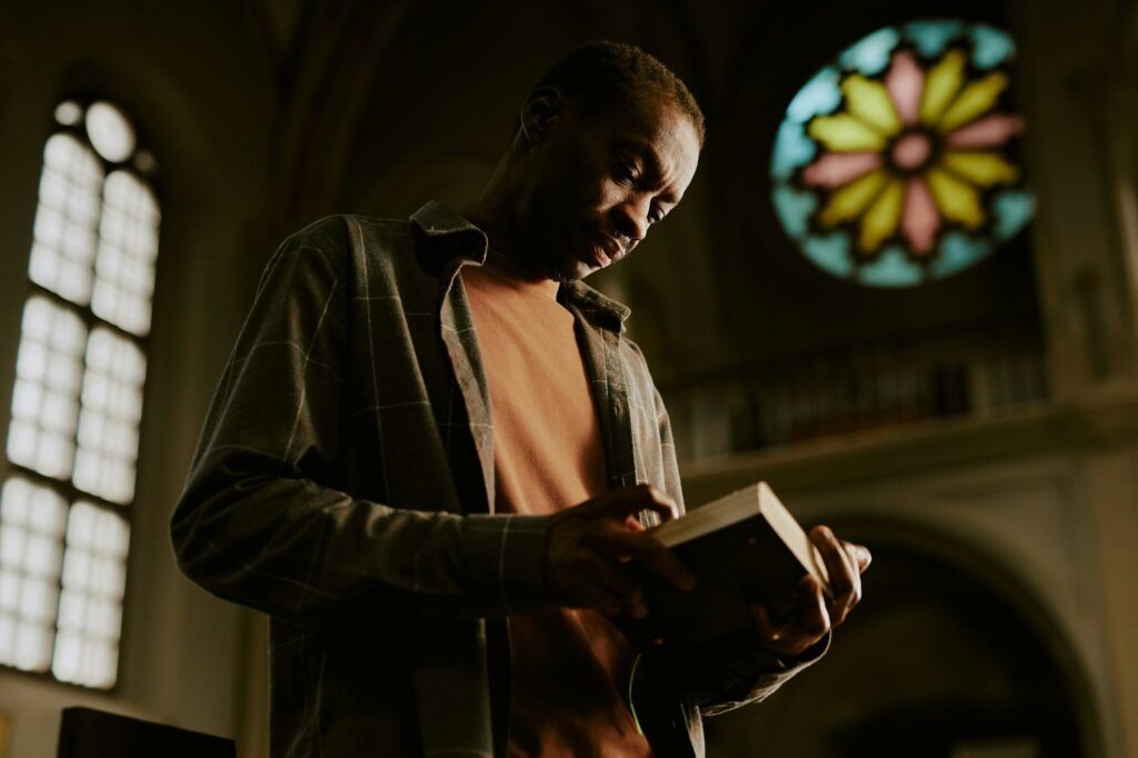 Black Man Reading Bible In Church